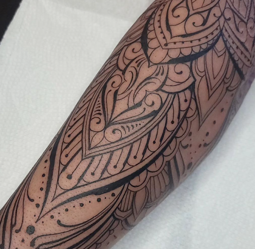 Explore flower arm tattoo ideas, creative tattoo ideas in Omaha, available at Collective Hive Tattoo