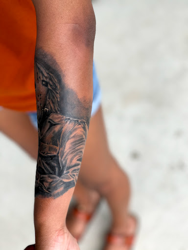 Explore female calf tattoo ideas, creative tattoo ideas in Goose Creek, available at Red Kirin Tattoo