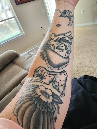 Explore traditional hand tattoo ideas, creative tattoo ideas in Newport News, available at Judgment Day Tattoo