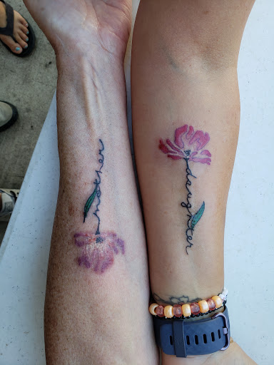 Explore tramp stamp tattoos ideas, creative tattoo ideas in Peoria Heights, available at Twisted Vision Inc