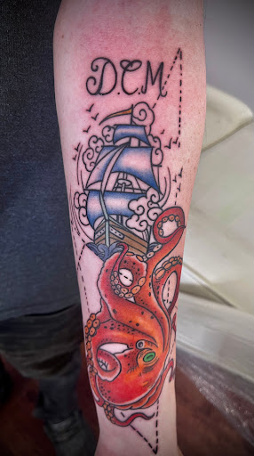 Explore lower leg tattoo ideas male, creative tattoo ideas in Rogers, available at Ink Solutions Tattoo