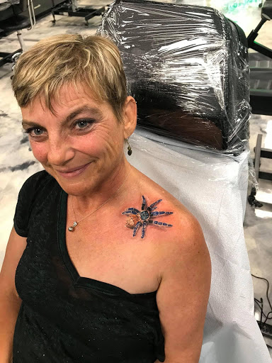 Find lion hand tattoo ideas for men for your next unique tattoo in San Diego at High Class Tattoo SD