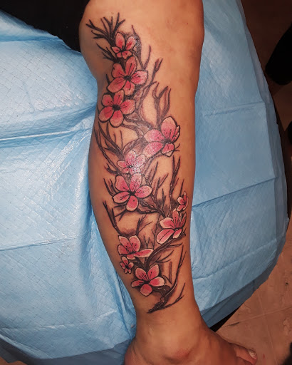 Explore weightlifting tattoo ideas, creative tattoo ideas in Cumberland, available at Queen City Ink