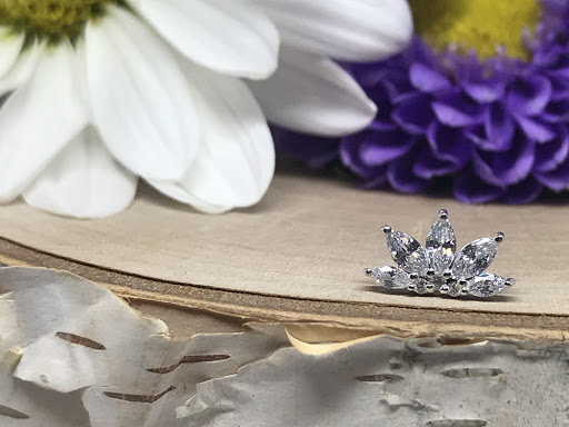 Explore thigh flower tattoo ideas, creative tattoo ideas in Spokane, available at Moms Custom Tattoo & Body Piercing