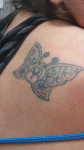 Explore bicep tattoo ideas for men, creative tattoo ideas in Denison, available at Mad House Tattoos