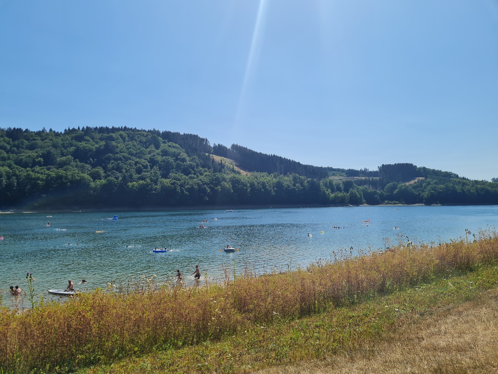 Foto van Badestelle am Schnutgenhof met turquoise puur water oppervlakte