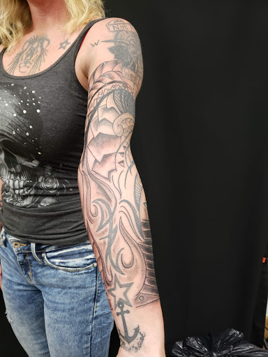 Find middle boob tattoo ideas for your next unique tattoo in Galesburg at Hawks Tattoos