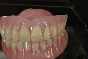 Pasang gigi Rizal Dental image