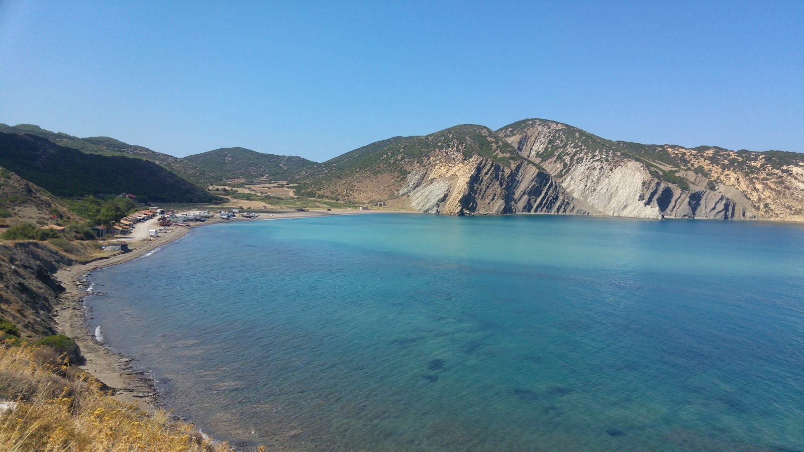 Foto de Ece Limani Beach con arena gris y rocas superficie
