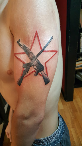 Explore mens shoulder tattoo ideas, creative tattoo ideas in Erie, available at Ink Assassins