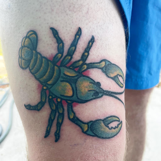 Explore dog tattoo ideas, creative tattoo ideas in Foley, available at Symbolic Ink Tattoo Studio