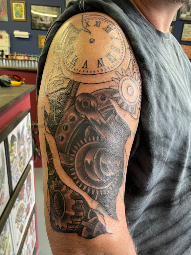 Explore blackout sleeve tattoo ideas, creative tattoo ideas in Grove City, available at Tattoo 62