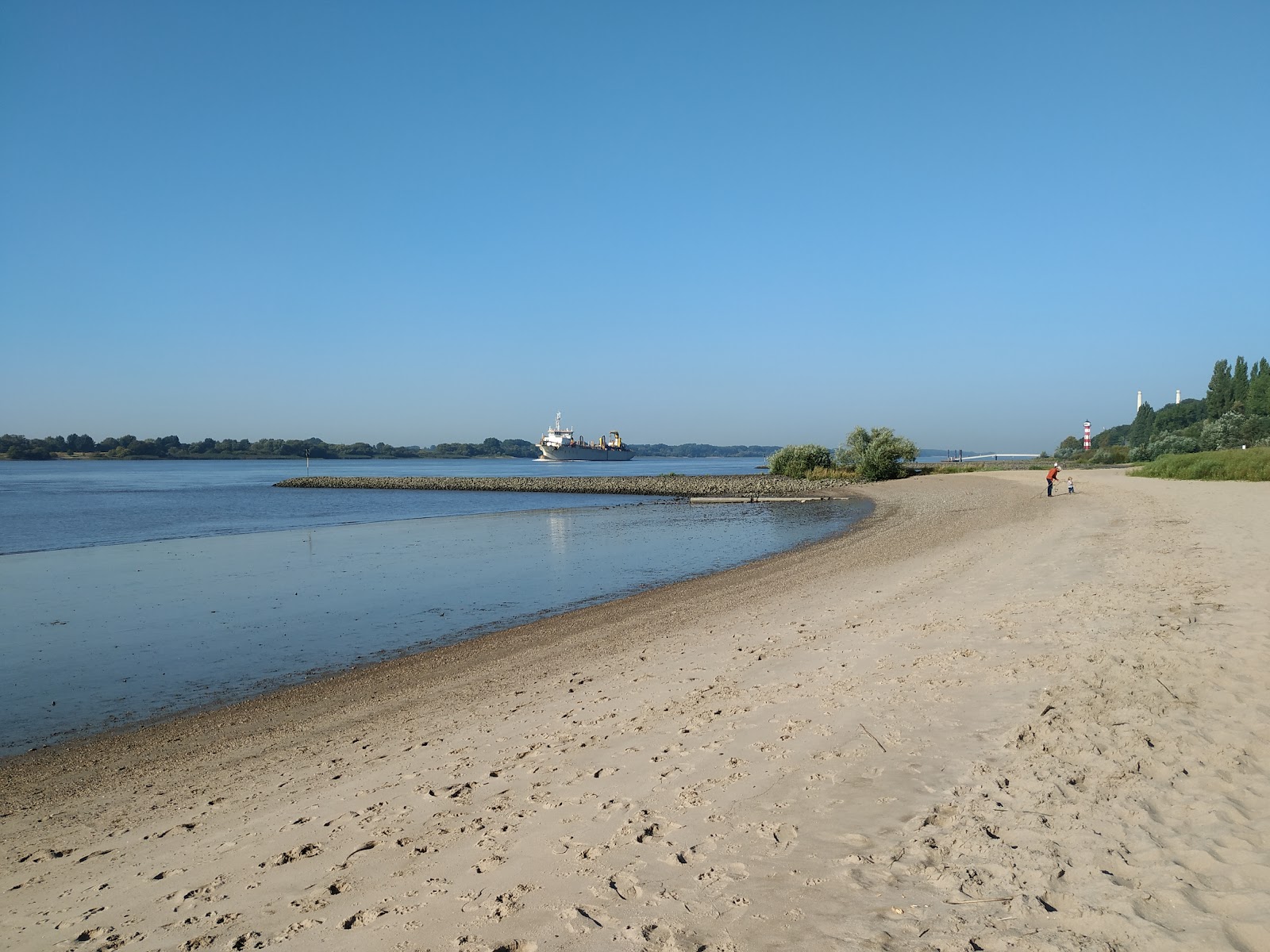 Foto van Falkensteiner Ufer met helder fijn zand oppervlakte