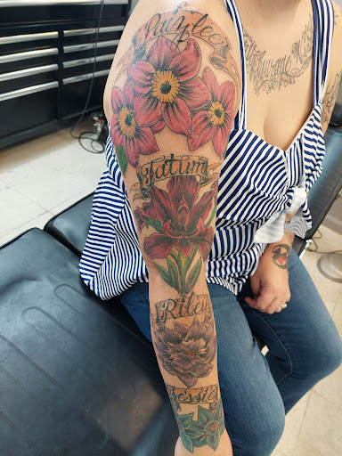 Explore fist tattoo ideas, creative tattoo ideas in Fort Mohave, available at RedRum Tattoo & Body Piercing Co.