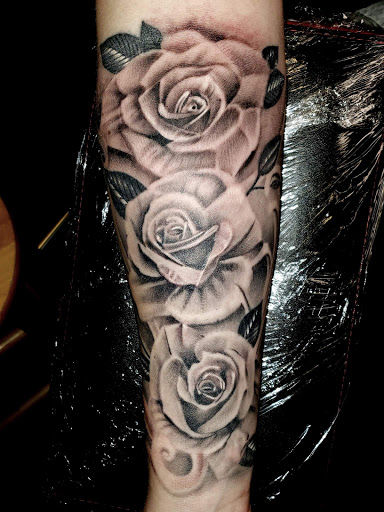 Explore upper arm tattoo ideas for females, creative tattoo ideas in Monroe, available at Vivid Art Tattoos