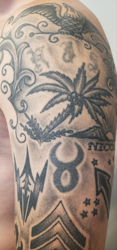 Explore red bird tattoo ideas, creative tattoo ideas in Peoria, available at Freedom Ink Tattoos