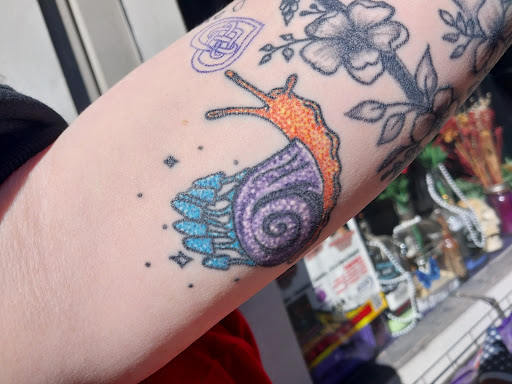 Explore ear tattoo ideas for women, creative tattoo ideas in Peckville, available at The Chaotic Cauldron Tattoos and More