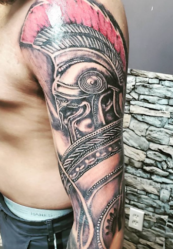 Explore red hand tattoo ideas, creative tattoo ideas in Passaic, available at District 36 Tattoo Parlor