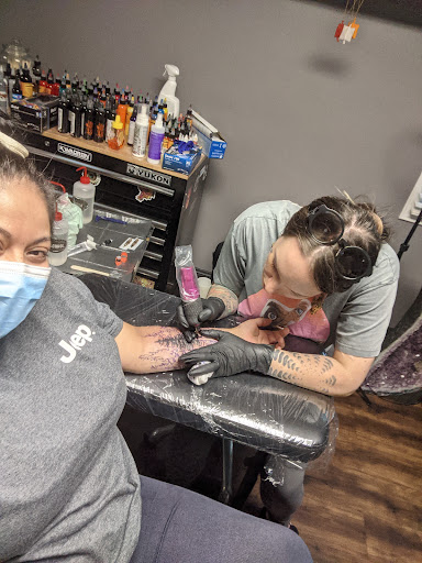Explore female throat tattoo ideas, creative tattoo ideas in Asheboro, available at Wonderland Tattoo