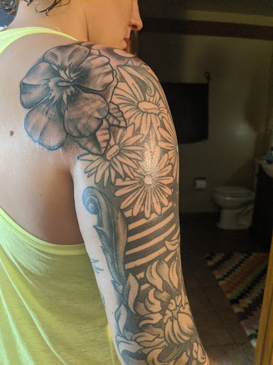 Explore forearm rose tattoo ideas, creative tattoo ideas in Fort Wayne, available at Dark Horse