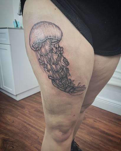 Find chrysanthemum tattoo ideas for your next unique tattoo in Cocoa at Rorschach Tattoo Shop and Piercing Studio