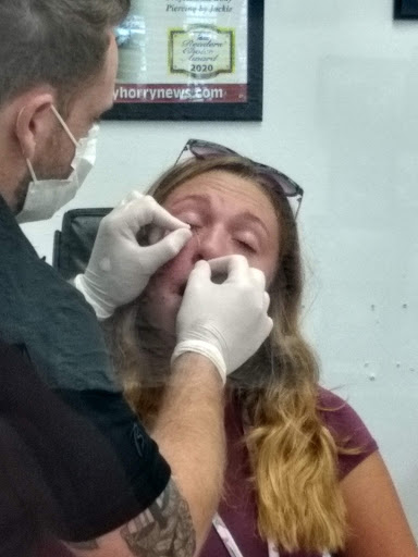 Explore gangster sleeve tattoo ideas, creative tattoo ideas in Myrtle Beach, available at Professional Body Piercing by Jackie