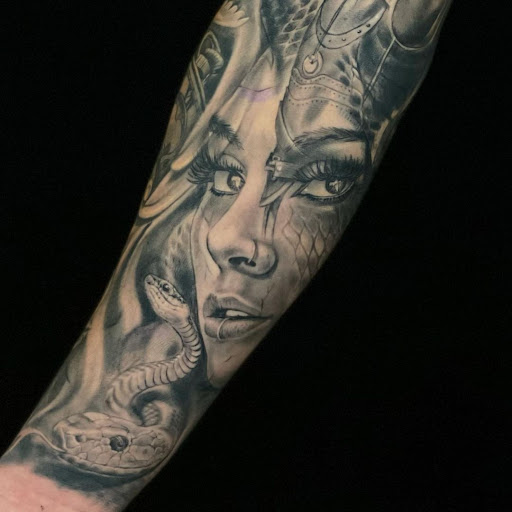 Explore arm blackout tattoo ideas, creative tattoo ideas in Kissimmee, available at Fallen Sparrow Tattoo Co