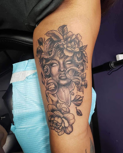 Find simple sun tattoo ideas for your next unique tattoo in Greensboro at Tate Street Tattoo Co, LLC