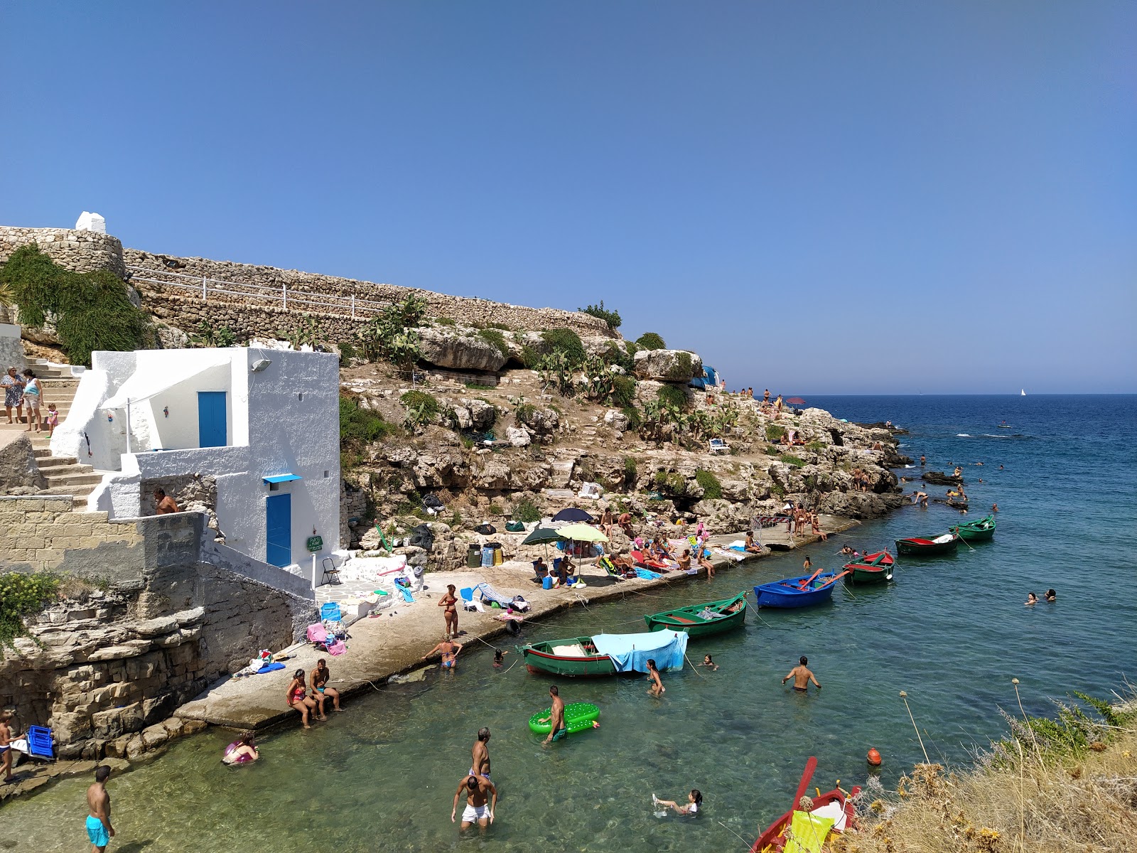 Foto von Cala Port'Alga mit felsiges gelände Oberfläche