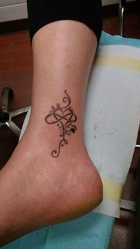 Find necklace tattoo ideas for your next unique tattoo in Peoria at Freedom Ink Tattoos
