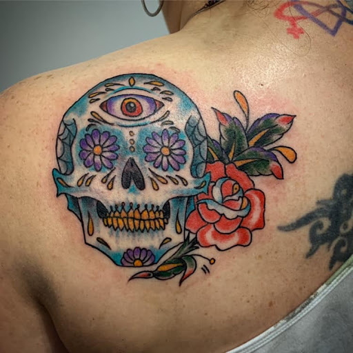 Explore happy tattoo ideas, creative tattoo ideas in Kansas City, available at Golden Stag Tattoo and Gallery