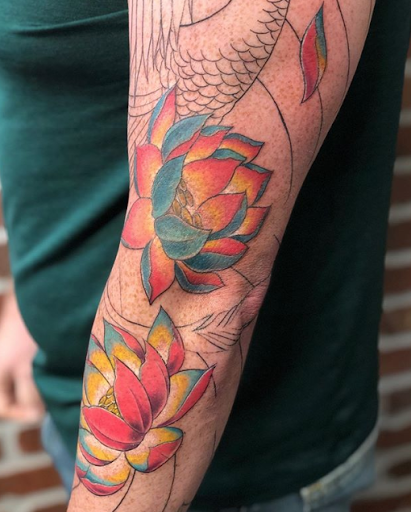 Find fish tattoo ideas for guys for your next unique tattoo in Arlington at Lady Octopus Tattoos