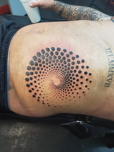 Explore back of neck tattoo ideas, creative tattoo ideas in Shelby, available at Ink Link Tattoos