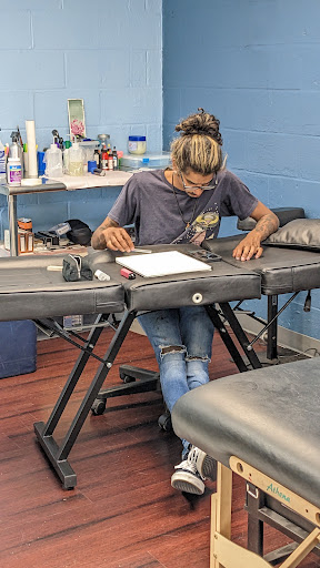 Find boyfriend name tattoo under breast ideas for your next unique tattoo in Brick at Hand Forged Tattoo