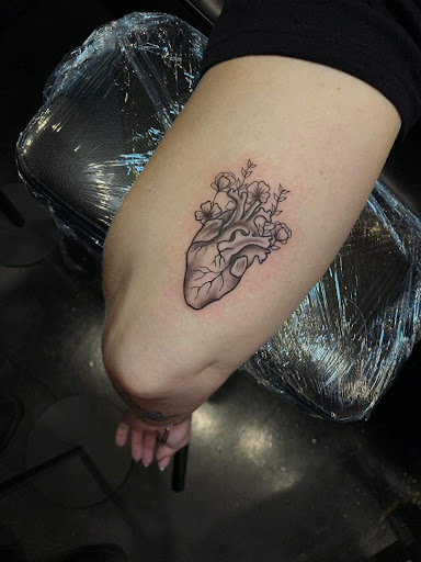 Explore last name back tattoo ideas, creative tattoo ideas in Melbourne, available at Bonnie n Clyde Tattoo Studio
