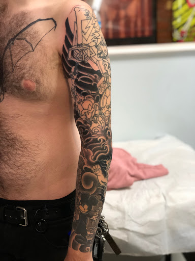 Find under the breast tattoo ideas for your next unique tattoo in Jeffersonville at Spring St. Tattoo