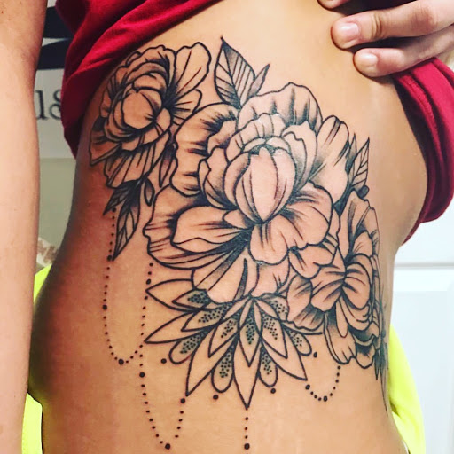 Explore neck tattoo ideas for females, creative tattoo ideas in Bloomington, available at Evil by the Needle Custom Tattoo and Piercing Studio