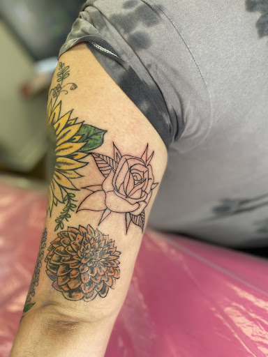 Explore motorbike tattoo ideas, creative tattoo ideas in Lake City, available at Crooked Spines Tattoo Studio
