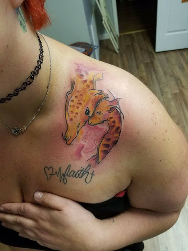 Find female rib tattoo ideas for your next unique tattoo in Radcliff at Iron Orchid Tattoo Radcliff
