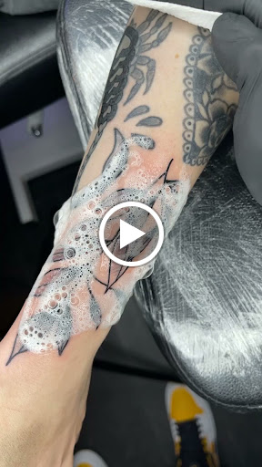 Explore lower back tattoo cover up ideas, creative tattoo ideas in Englishtown, available at Battlefront Tattoo Company
