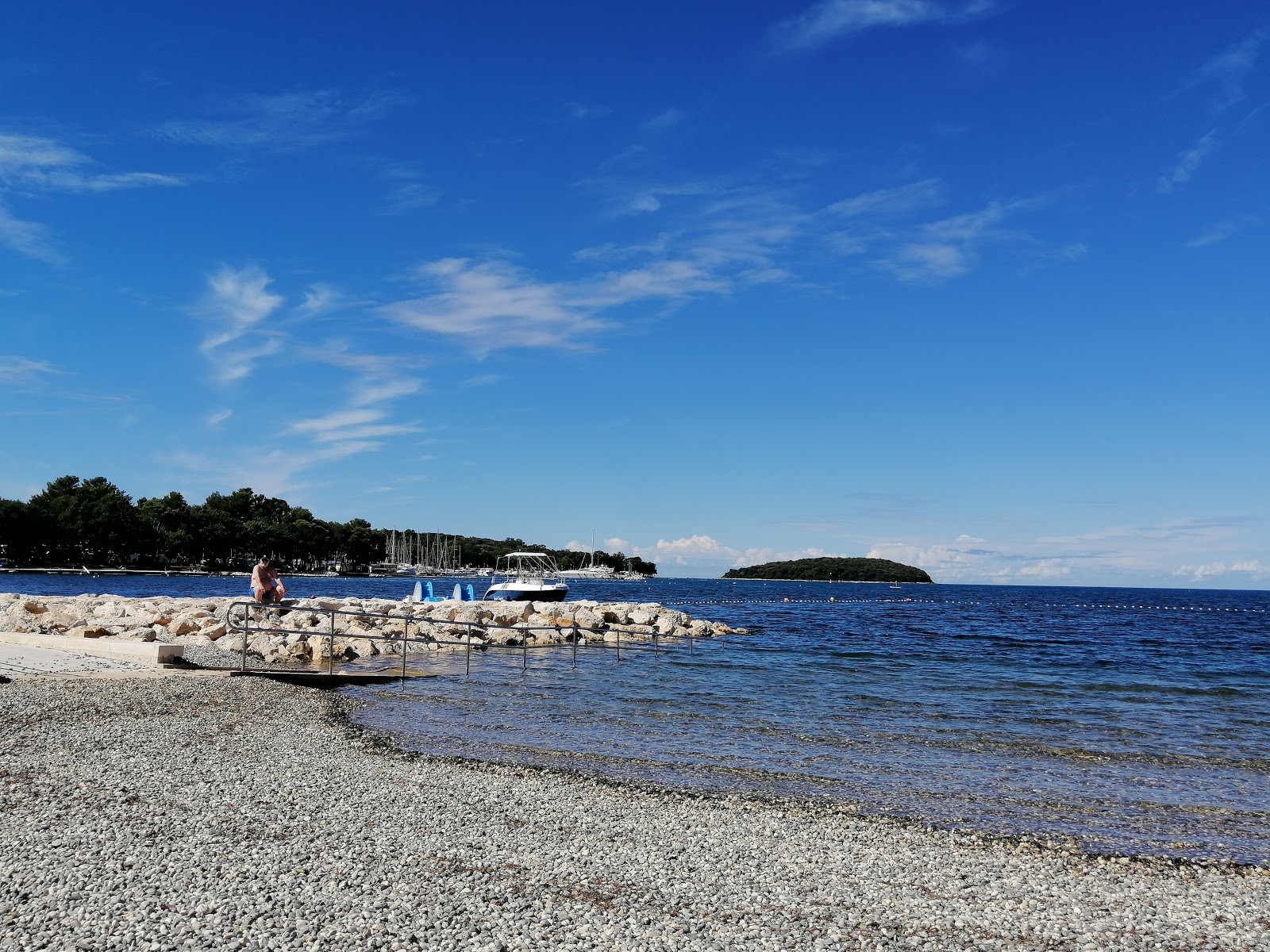 Foto di Spiaggia di Funtana con una superficie del ciottoli beige