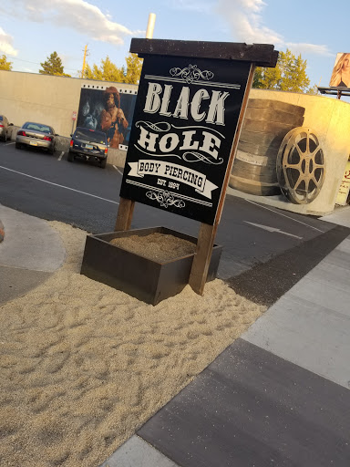 Explore tramp stamp cover up tattoo ideas, creative tattoo ideas in Reno, available at Black Hole Body Piercing