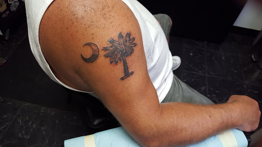 Explore male calf tattoo ideas, creative tattoo ideas in Summerville, available at Mystic Tiki Tattoo Studio & Gallery