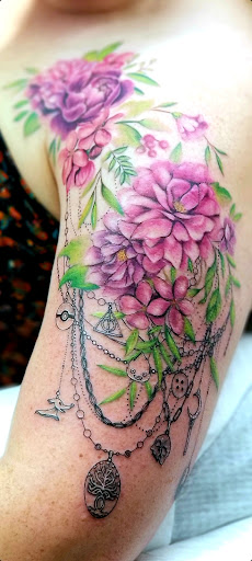 Explore chest cover up tattoo ideas, creative tattoo ideas in Benton, available at Spectrum Tattoo