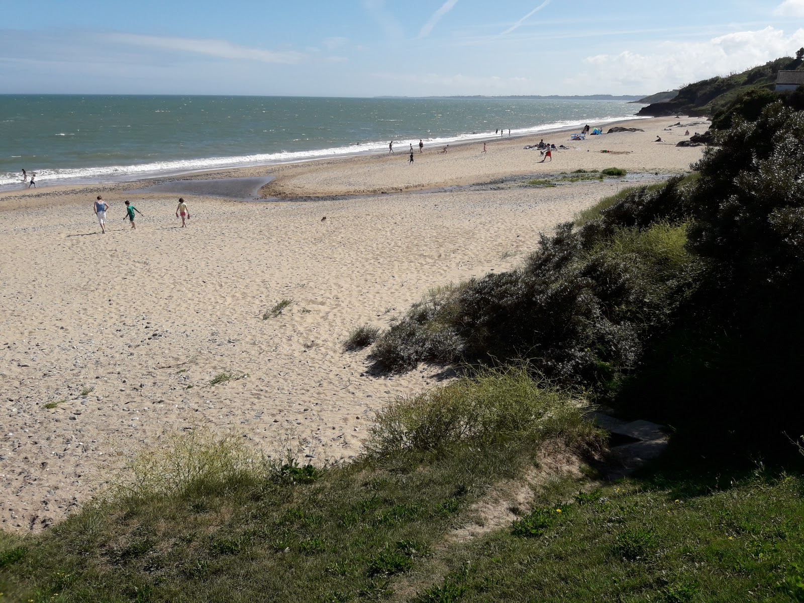 Ballymoney Beach'in fotoğrafı geniş bir kıyı şeridi ile birlikte