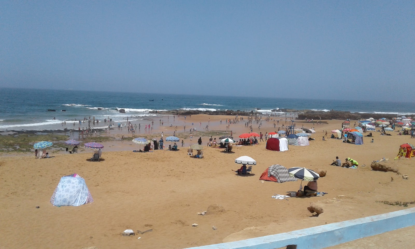 Foto av Cap Beddouza med lång rak strand