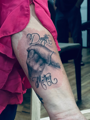 Find tattoo ideas between breast for your next unique tattoo in Brunswick at Brunswick Tattoo Company