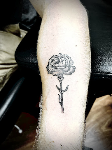 Explore rose sleeve tattoo ideas, creative tattoo ideas in Cocoa, available at Rorschach Tattoo Shop and Piercing Studio