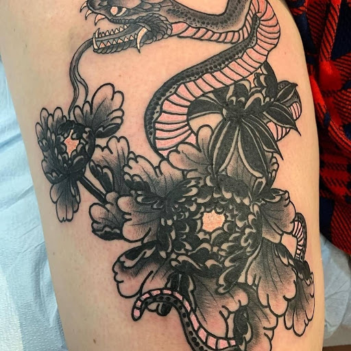 Explore female tattoo ideas for lower back, creative tattoo ideas in Ambler, available at Tattoo GalaxyAmbler Piercing & Custom Tattoos