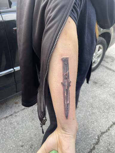 Explore cover up tattoo ideas for shoulder, creative tattoo ideas in Angola, available at Hoodlum Ink